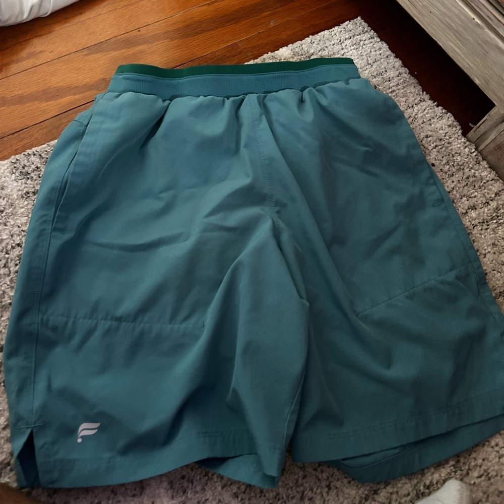 Fabletics lined cyan men’s shorts